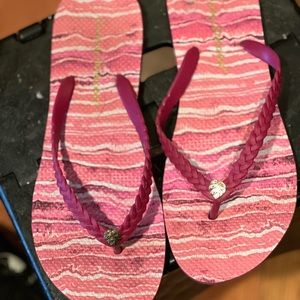 Tommy Bahama flip flops.